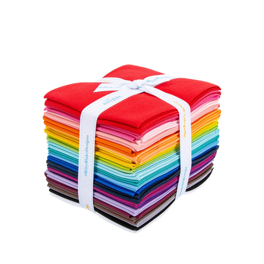 Riley Blake Confetti Cotton Riley Rainbow Fat Quarter Bundle with 24 precut solid cotton pieces in a full spectrum of rainbow colors for quilting and patchwork.
